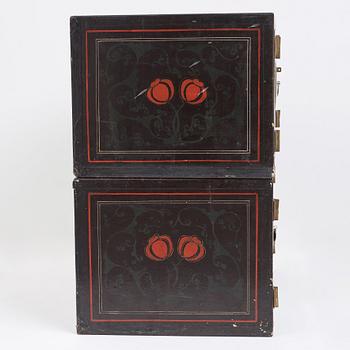 A lacquered cabinet, in two sections, Qing dynasty, 19th Century.