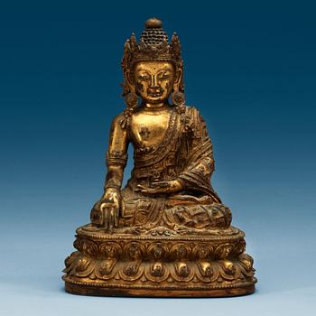 1379. A Tibetan gilt bronze figure of Bodhisattva, presumably 17/18th Century.