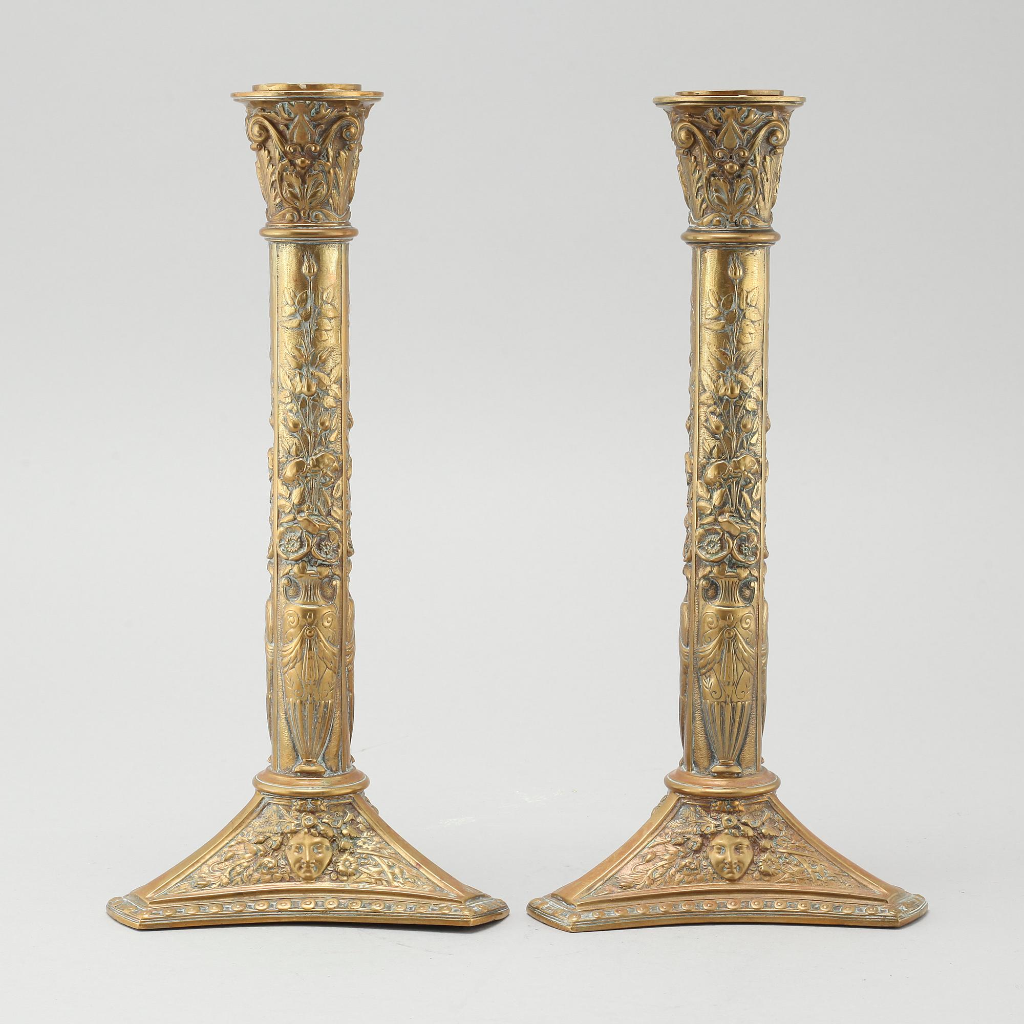 A pair of brass candlesticks from Elkingtons in Birmingham, 19th century.