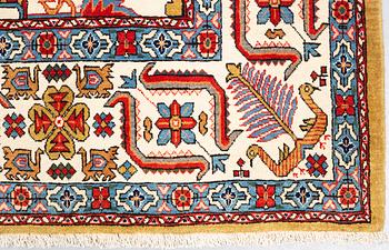 A carpet, semi-antique Qum, ca 342,5 x 222 cm.