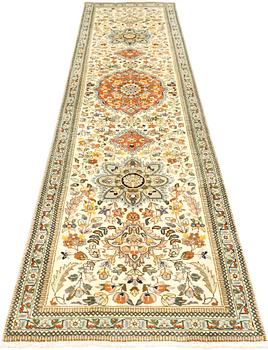 A Tabriz runner, c. 320 x 75 cm.