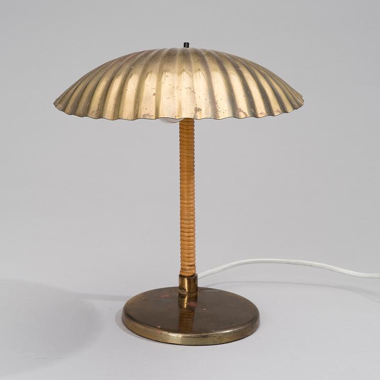 PAAVO TYNELL, A DESK LAMP. Shell. Manufactured by Taito Oy. Designed in 1938/-39.