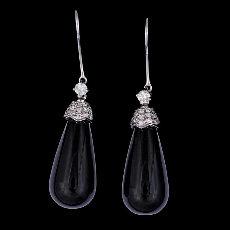 A pair of black onyx and brilliant cut diamond earrings, tot. 0.45 cts.