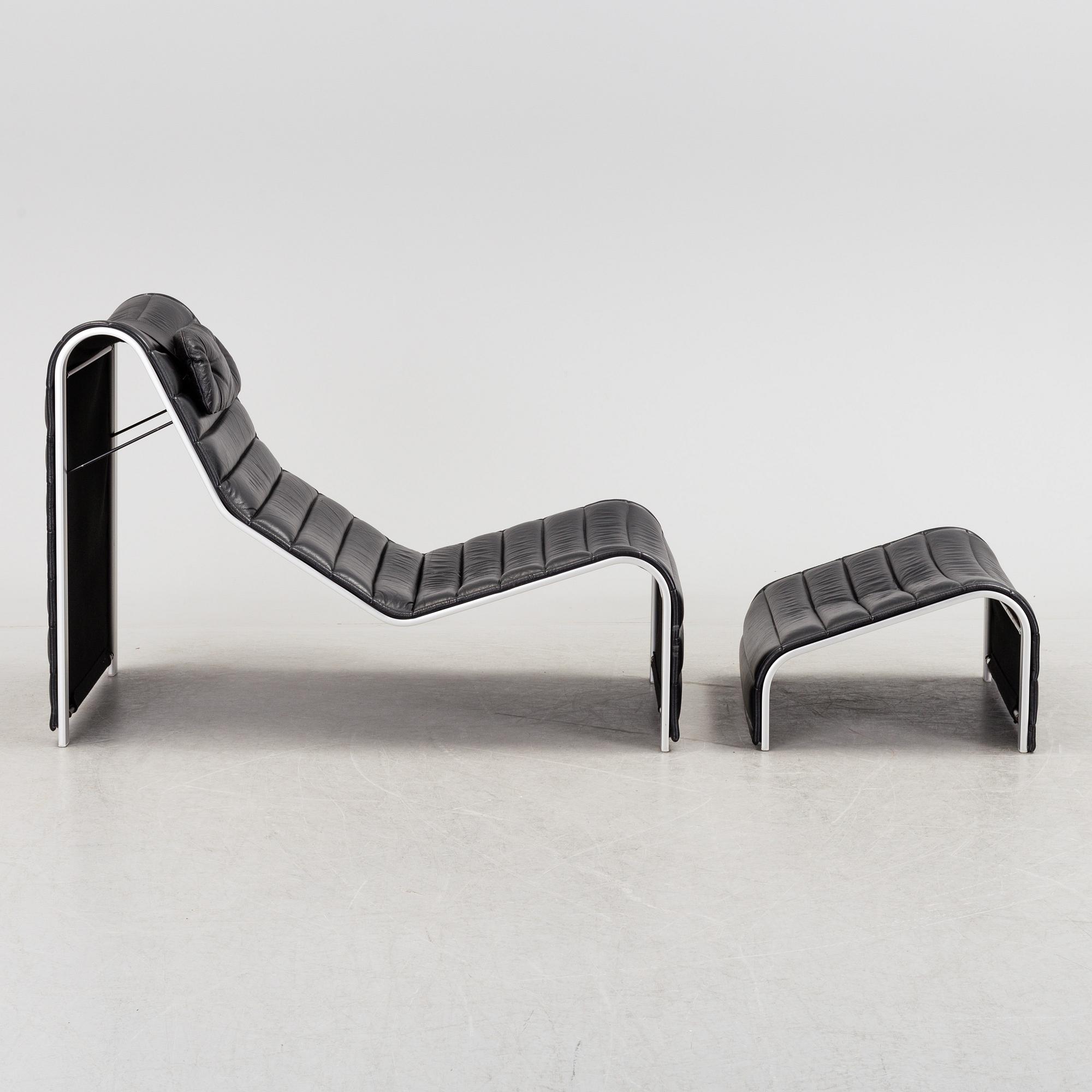 ERIC SIGFRID PERSSON, a leather upholstered lounge chair and foot stool from Möbelkultur AB.