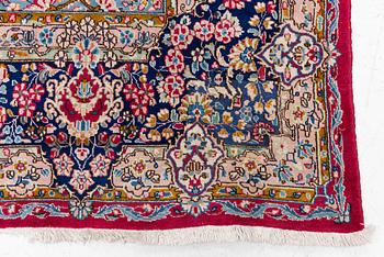 A Kirman carpet, signed, c. 388 x 279 cm.