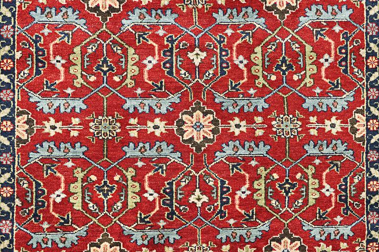An oriental carpet, c. 301 x 239 cm.