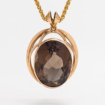 A 14K and 18K gold necklace with a smoky quartz. Olavi Nupponen, Helsinki 1963 and Tillander, Helsinki 1996.