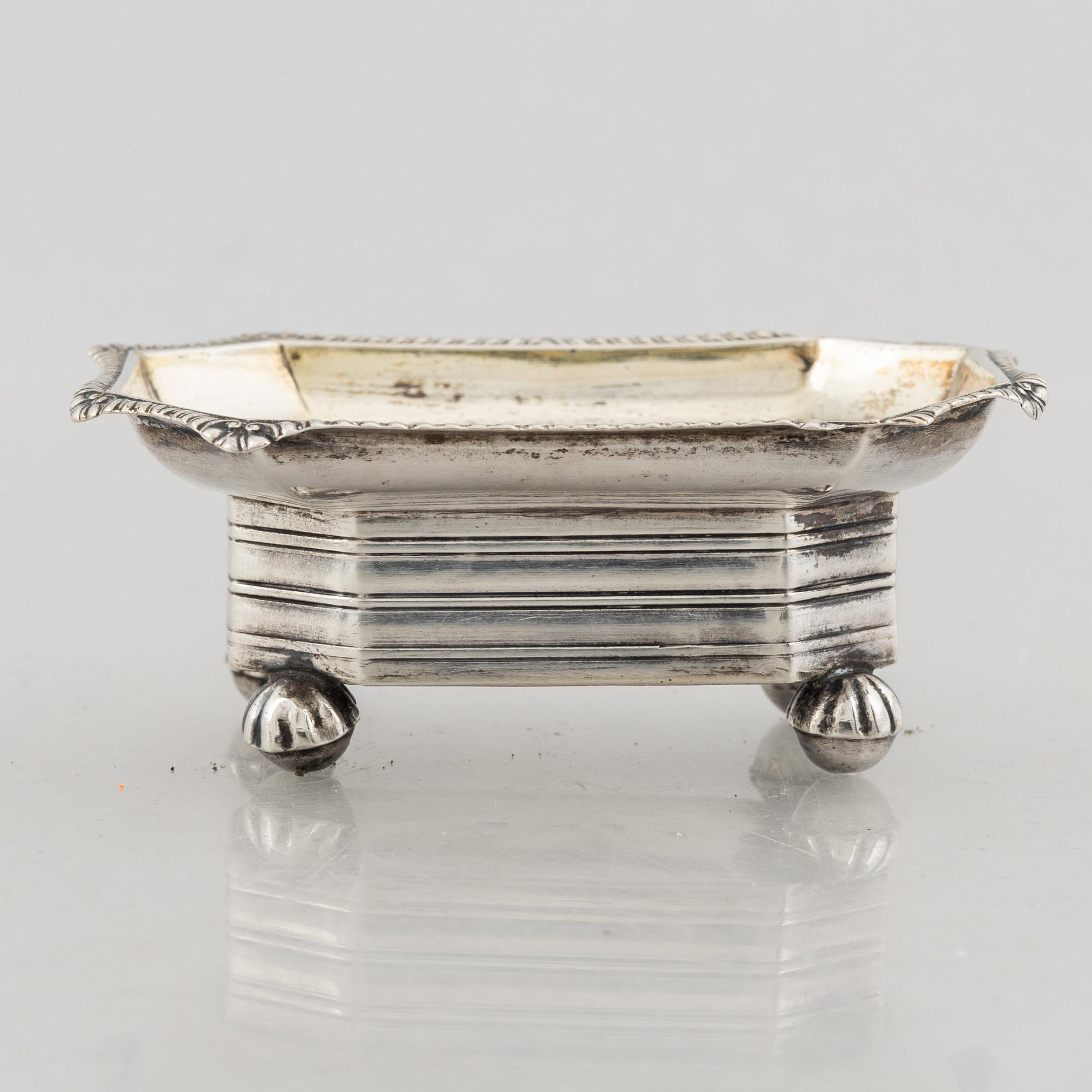 A silver cream jug, mark of Gustaf Theodor Folcker, Stockholm 1856 and a spice jar, Carl Stahle, St Petersburg 1837.