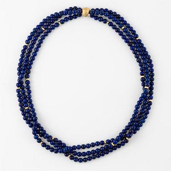 Ole Lynggaard, gold necklace with three-strand necklace with lapis lazuli.