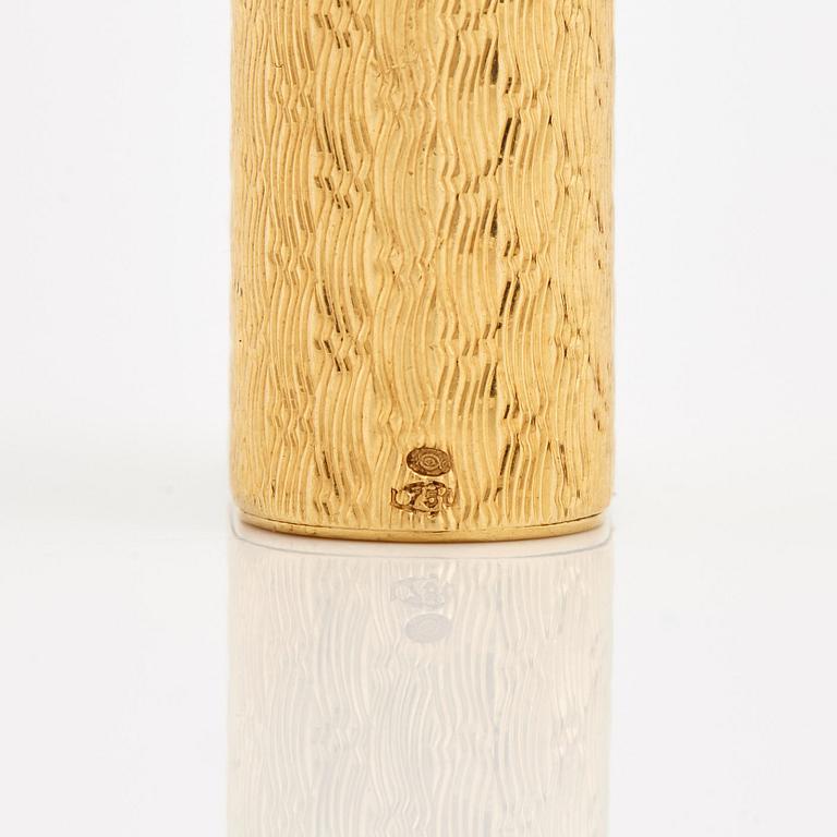 A cigarette lighter by Cartier set with single cut diamonds.