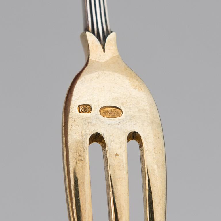 A set of Fabergé parcel-gilt silver dessert cutlery, 11 pieces + one fork later manufactured by Kultakeskus, Finland.