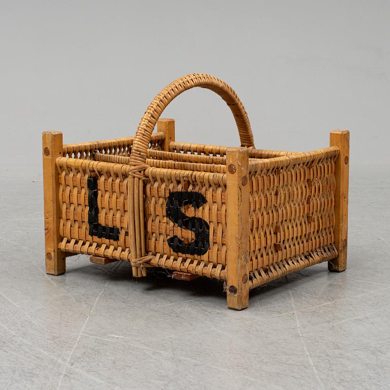 A rattan bottle basket.