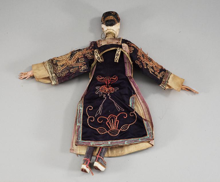 A pair of chinese bisque dolls with silk clothing, Qing dynasty.