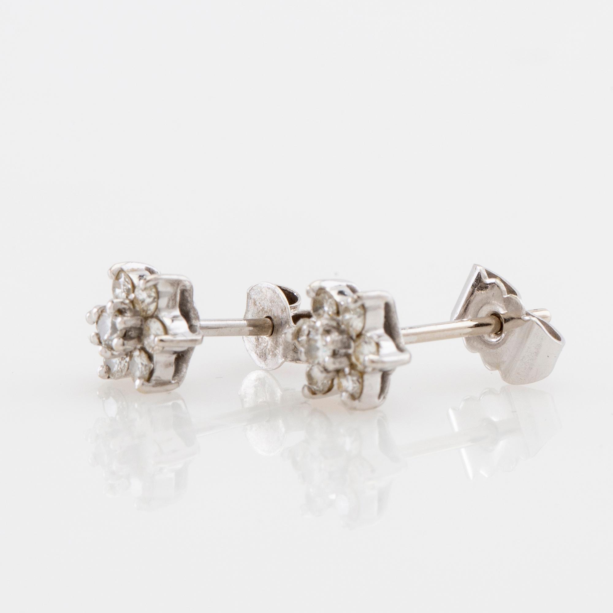 Earrings, a pair of 18K white gold set with round brilliant-cut diamonds.