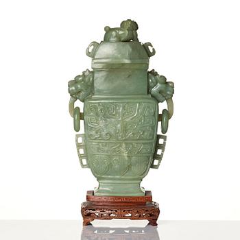 A Chinese archaistic bowenite vase with cover, Republic/20th century.
