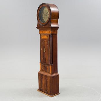 A 19th century Longcase Clock with arched brass dial inscribed Thomas Atkinson, Ormskirk, England.