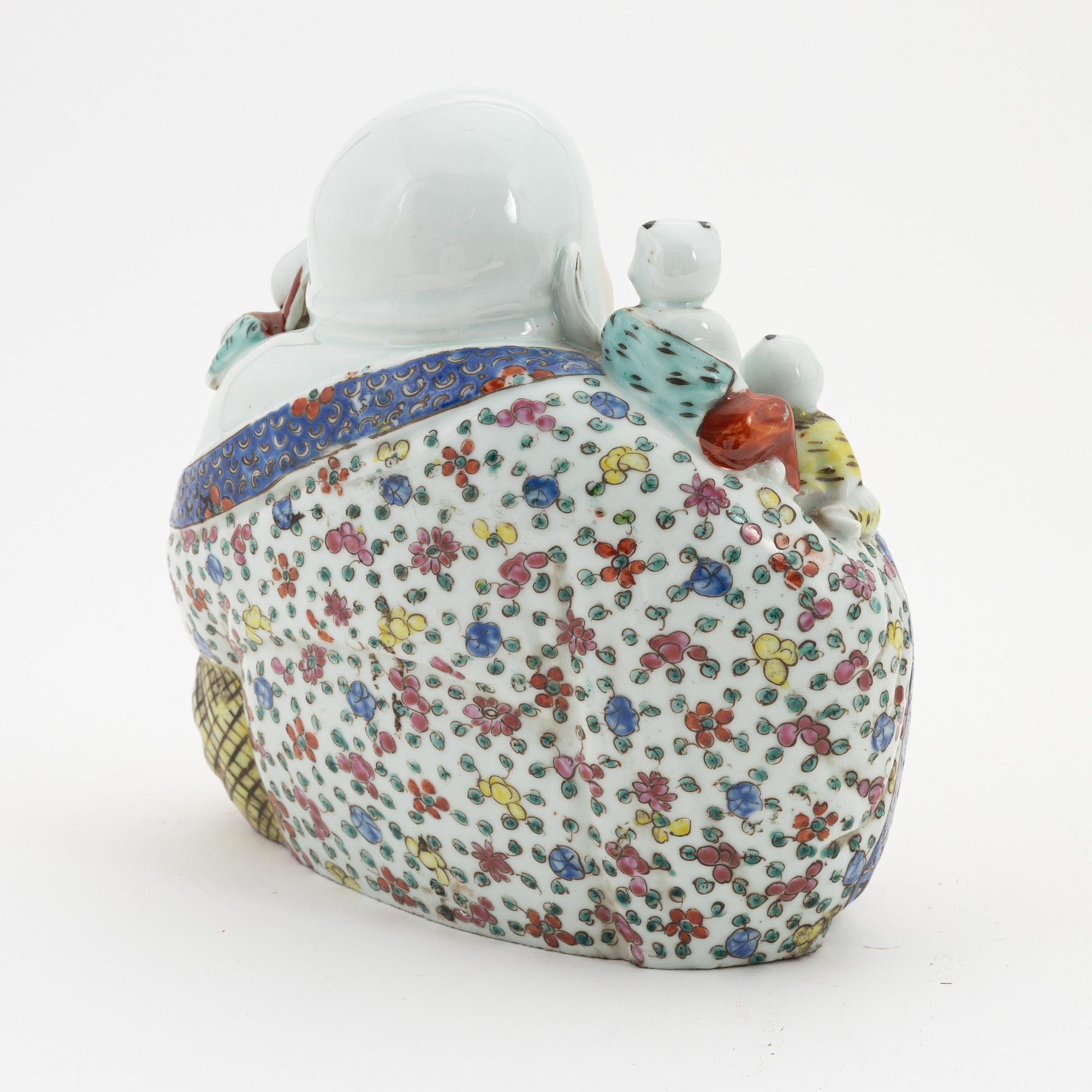 A porcelain 'Budai' figure, China, 20th Century.