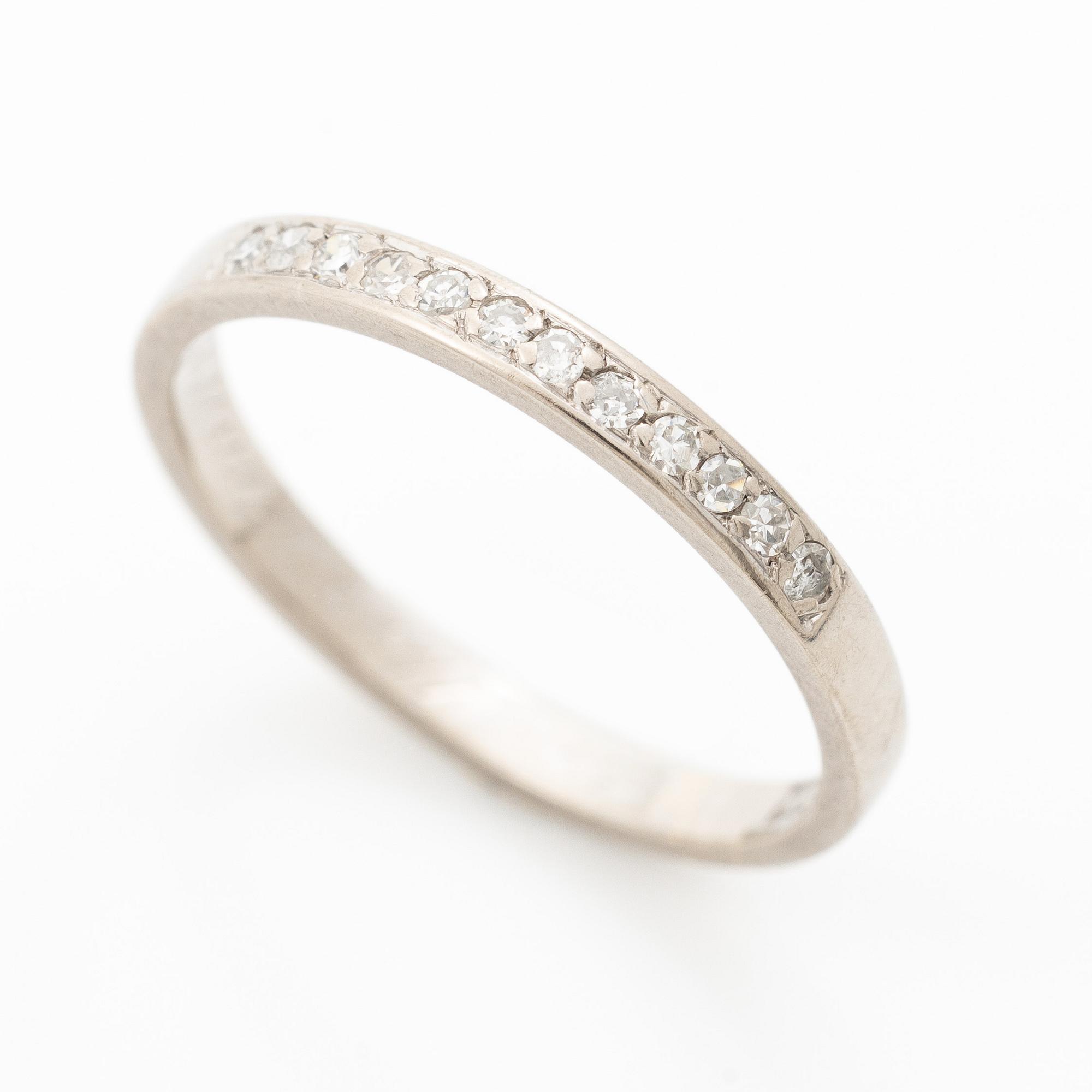 18K white gold half eternity ring with octagonal-cut diamonds.