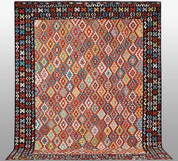 A Kelim carpet, c. 398 x 311 cm.