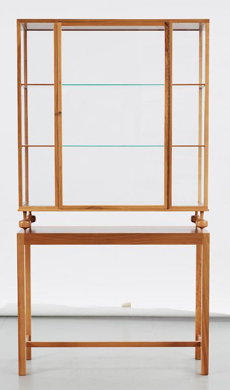A Josef Frank walnut showcase cabinet, Svenskt Tenn, model 2077.