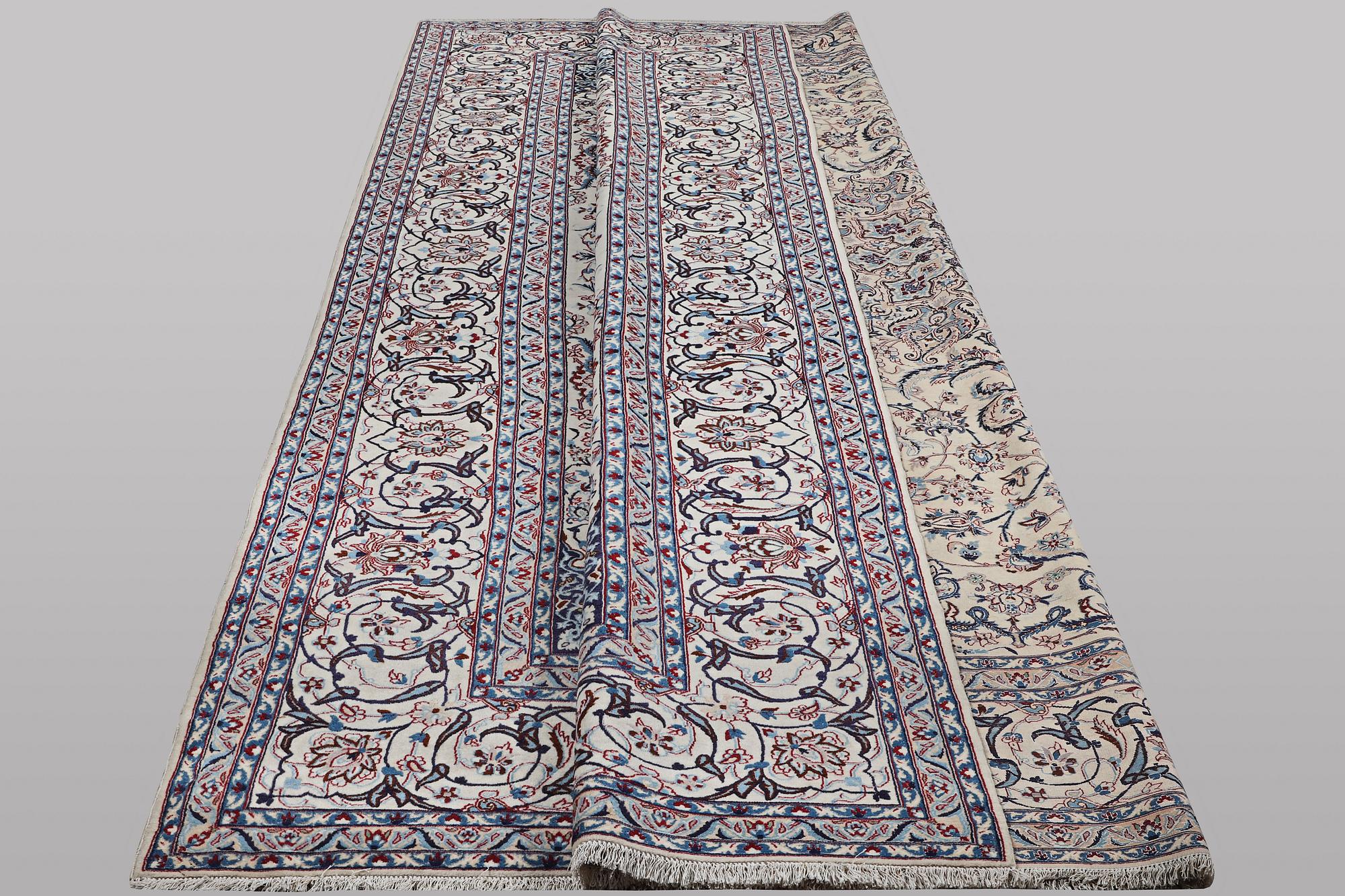 A carpet, Nain, part silk, ca 426 x 309 cm.