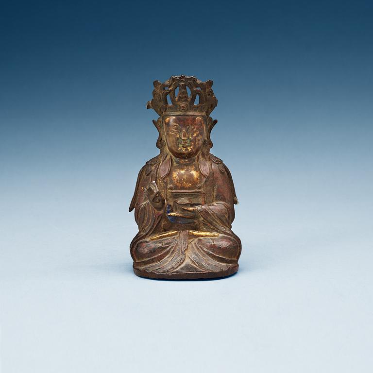 A bronze figure of a seated Guanyin, Ming dynasty.