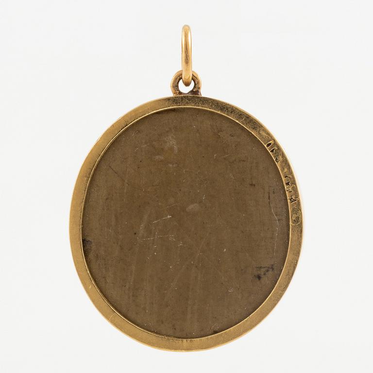 Pendant in 14K gold with a lava cameo.