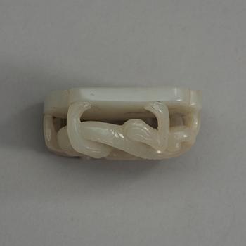 A carved white nephrite belt ornament, Qing dynasty (1644-1912).