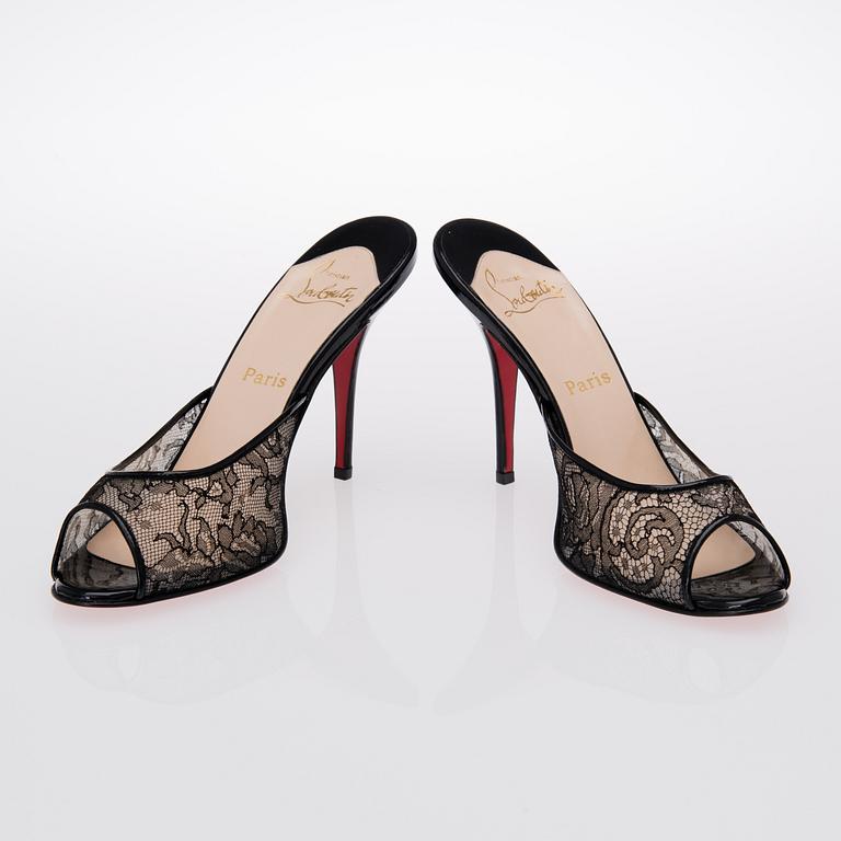 A PAIR OF CHRISTIAN LOUBOUTIN LACE MESH AND LEATHER MULES, size 41.5.