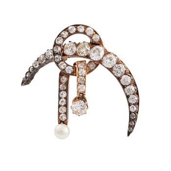548. A 14K gold brooch set with old-cut diamonds and a pearl.