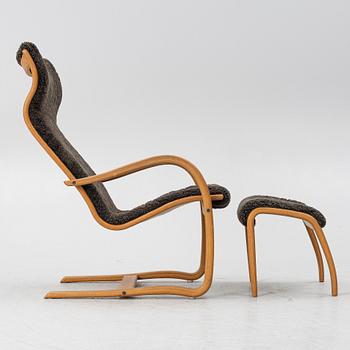 Jan Ekström, a "Gazell" armchair with a footstool, 21st century.
