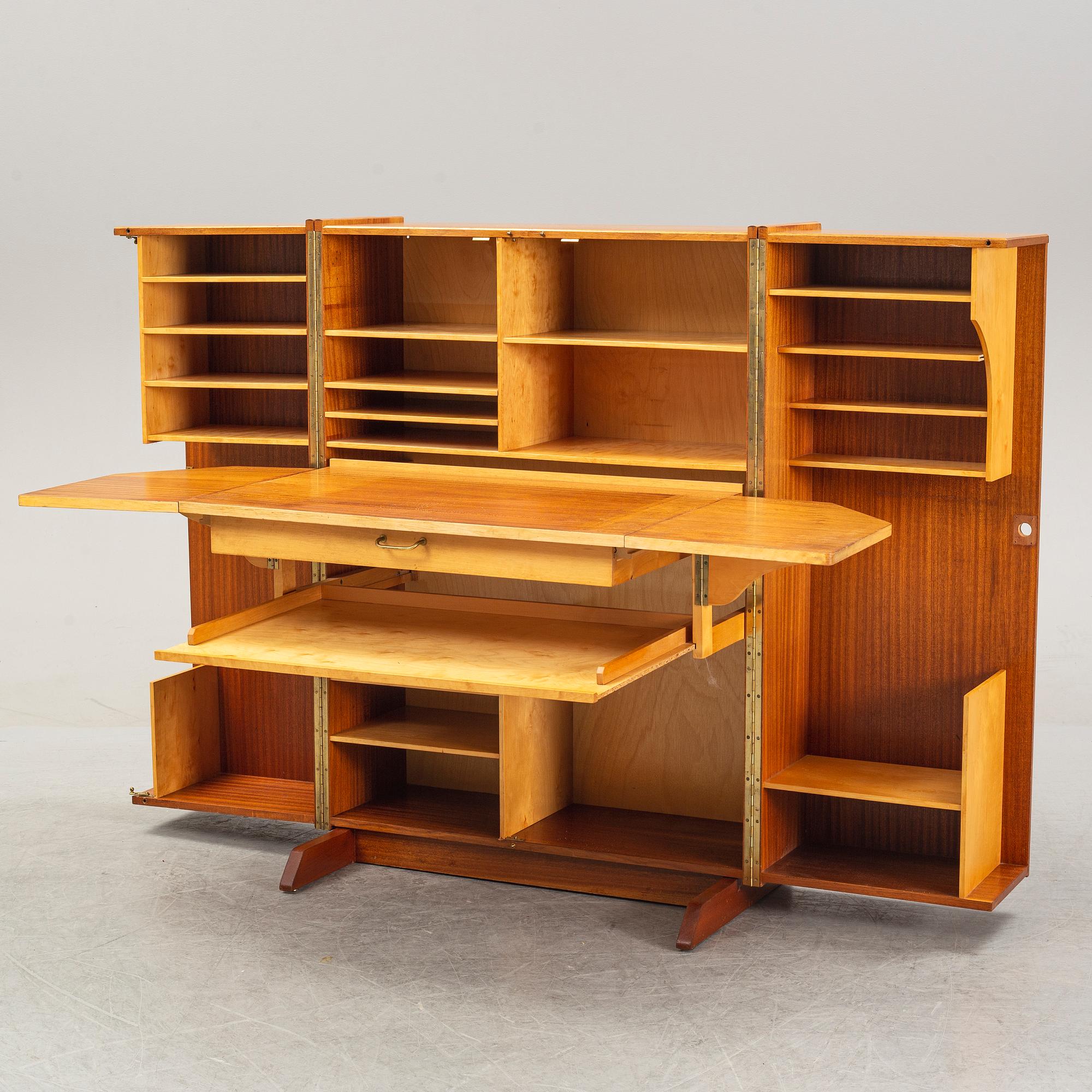 A mahogany veneered convertible cabinet, mid 20th Century.