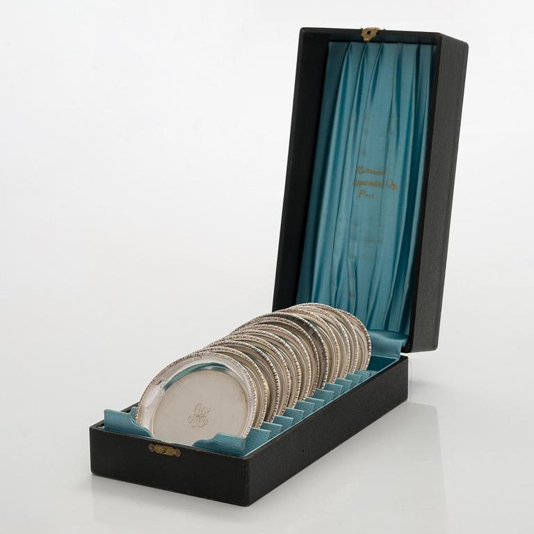 A 12-piece set of silver glass coasters, Kultakeskus, Hämeenlinna 1952. In original fitted case.