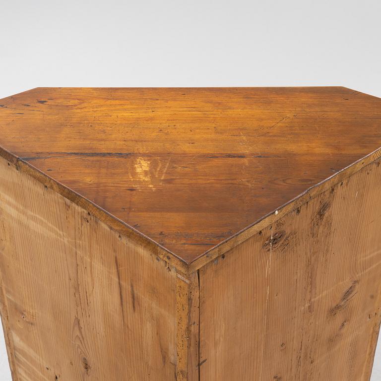 A Gustavian style pinewood corner cupboard, 19th Century.