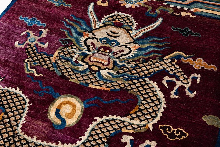 A Chinese silk and metal-thread 'Dragon' pillar rug, Bejing, North China, around 1910, c. 234x151 cm.