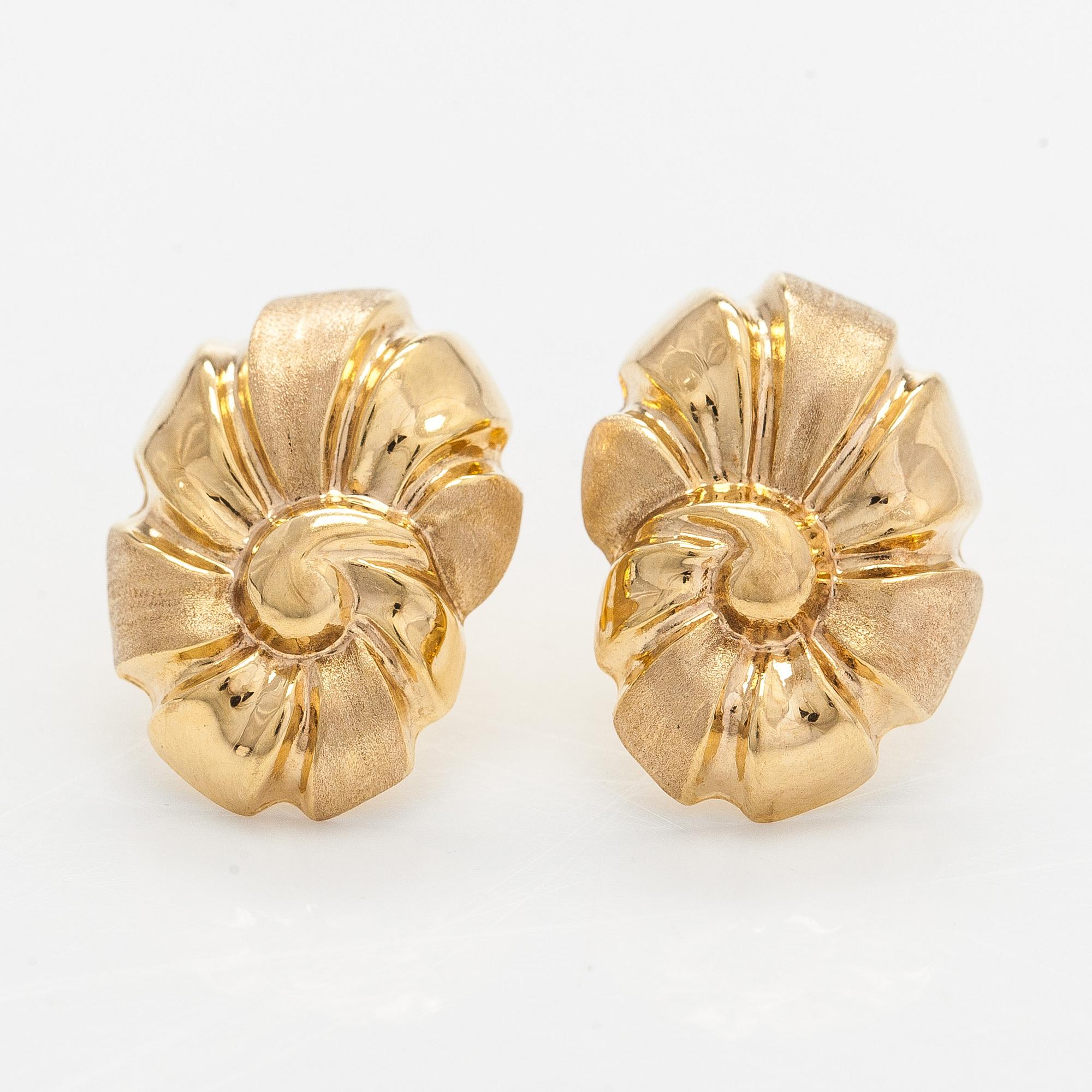 A pair of 14K gold earrings.