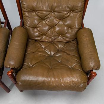 A pair of leather armchairs, 1970s.