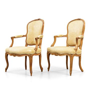 Two matched Louis XV 18th century armchairs.