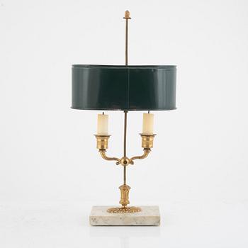 A French Empire ormolu, tôle-peinte and marble two-branch reading light, early 19th century.