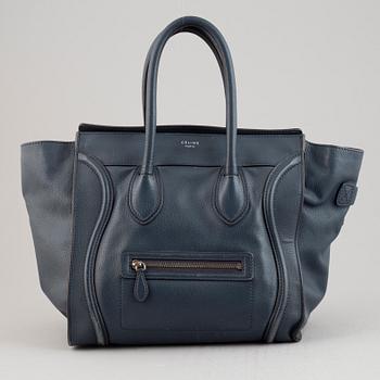 Céline, a teal leather 'Luggage' handbag.