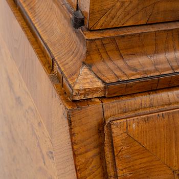 A Swedish rococo burr-alder veneered cabinet, later part 18th century.