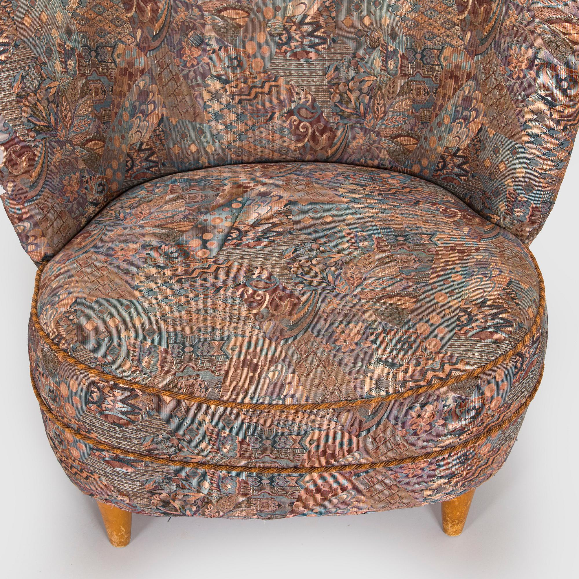 A pair of mid-20th century armchairs.