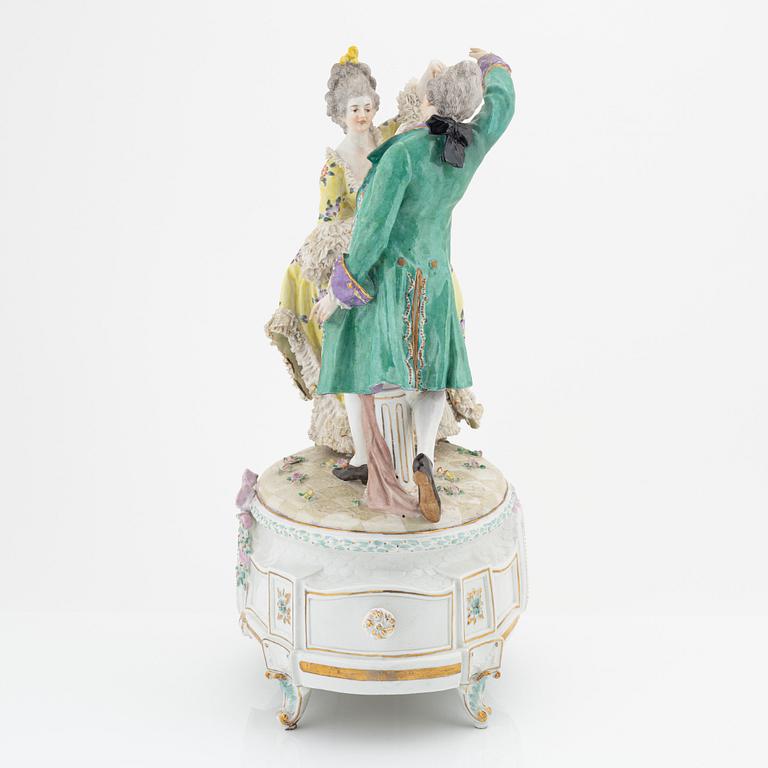 A rococo style porcelain figurine from the early 20th century.