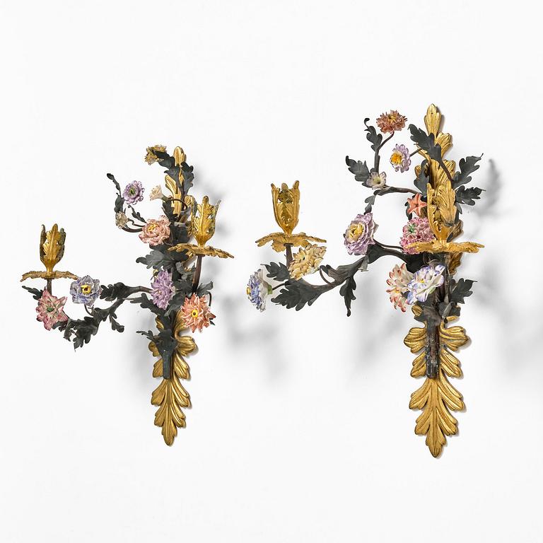 A pair of French Louis XV-style gilt bronze and porcelain two-branch appliques, 19th century.
