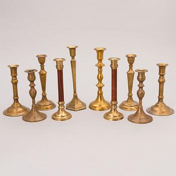 Set of ten 19th/20th Century brass and wood candlesticks.