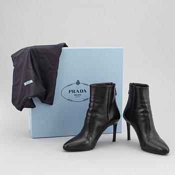 PRADA, a pair of black leather boots, size 35.