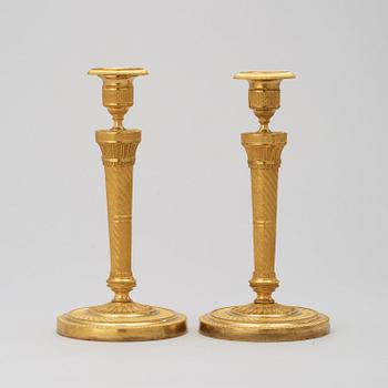 A pair of French Empire 19th century candlesticks.