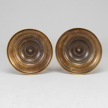 A pair of ormolu candlesticks, first half of the 19th century.