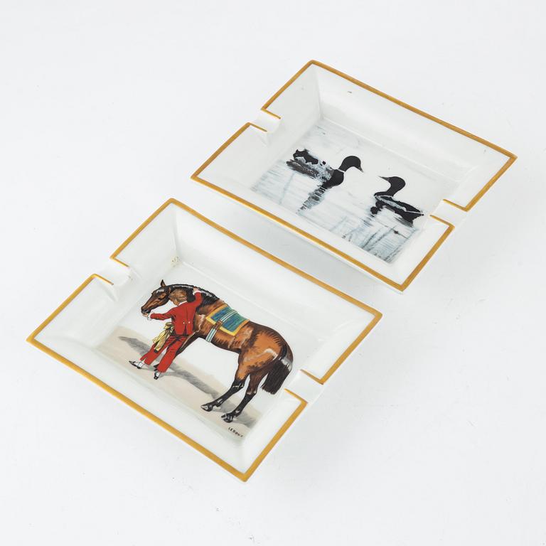 Two Hermès porcelain ashtrays.