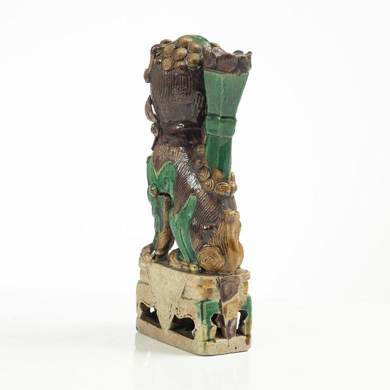 A Sancai glazed Buddhist lion incense/joss stick holder, Qing dynasty, Kangxi (1662-1722).